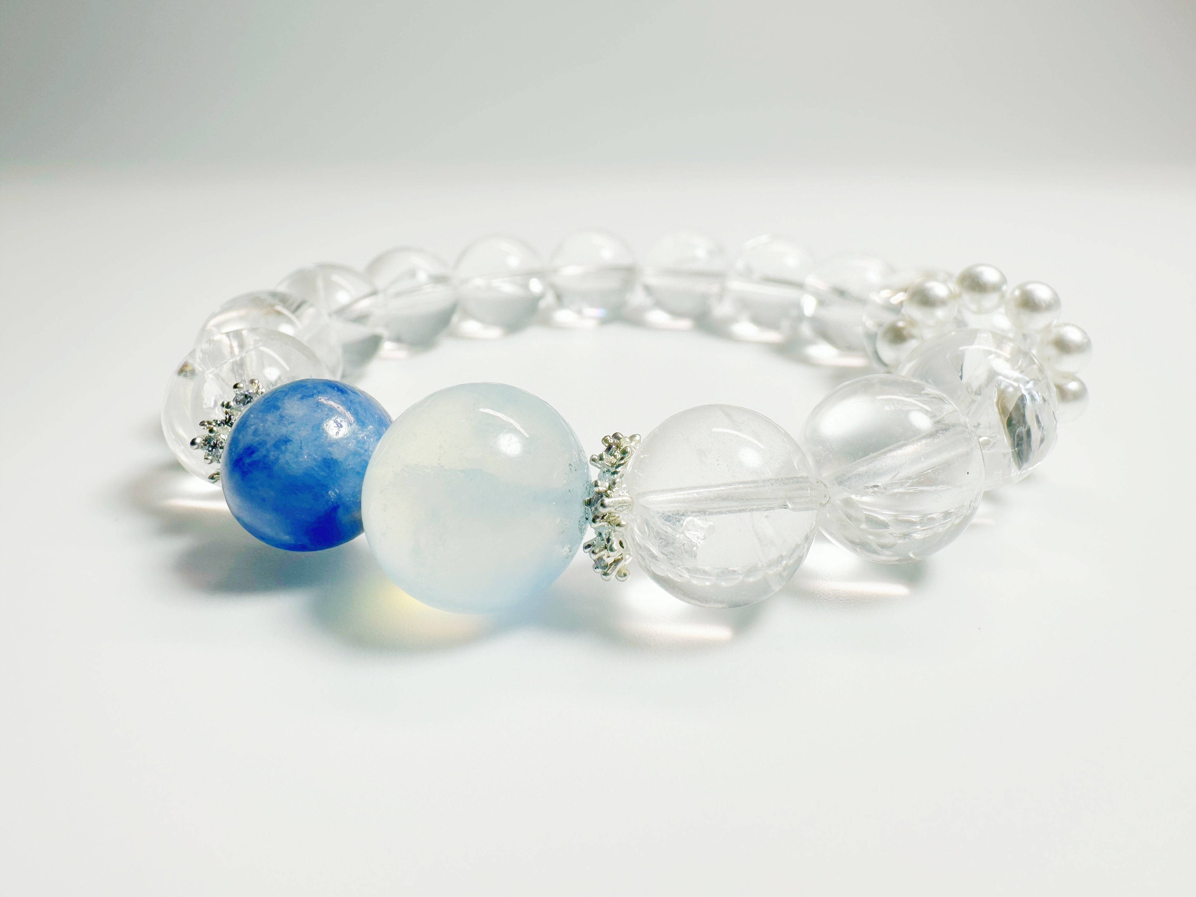 Feng Shui -Clear Quartz -Kyanite  -Alternating clear quartz and icy-blue kyanite cylinders create a glacier-cool palette that pairs effortlessly with office or evening wear. Enhances clarity & peaceful energy.