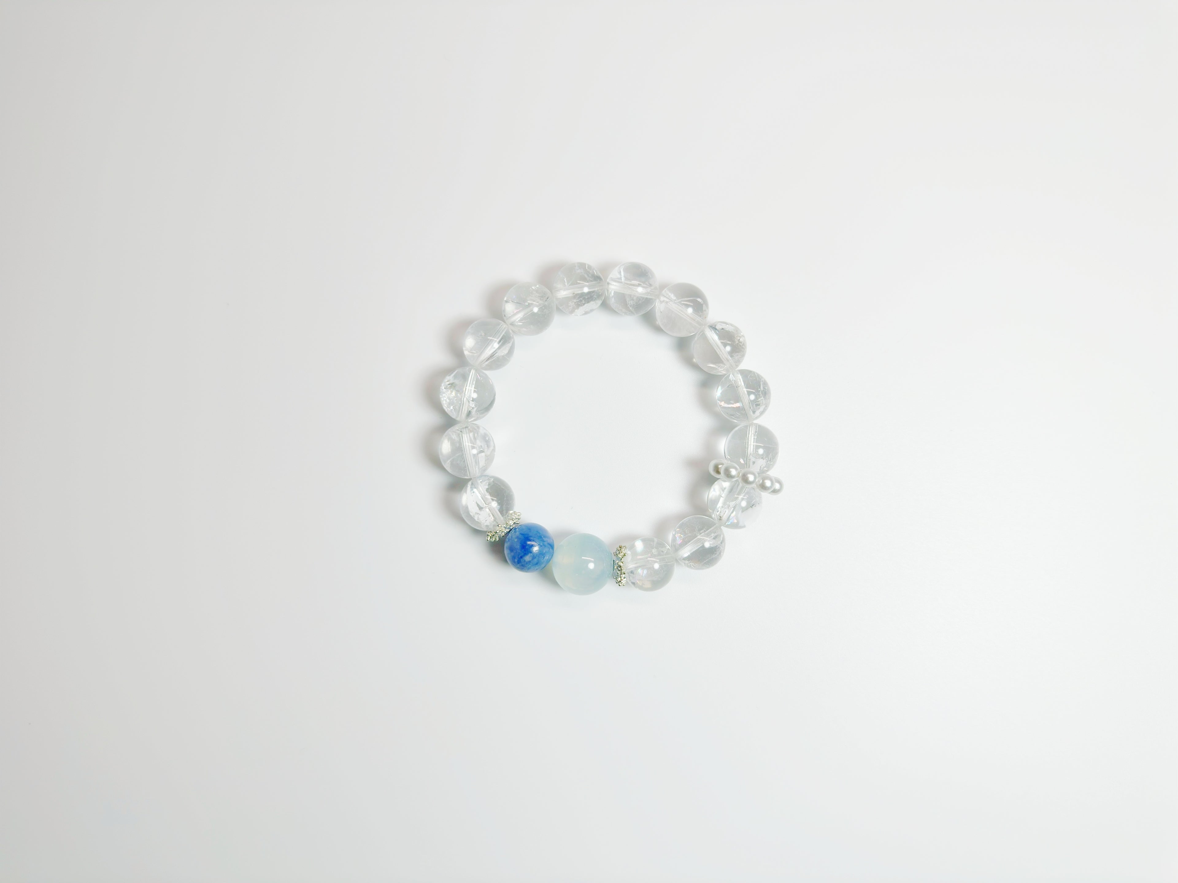 Feng Shui -Clear Quartz -Kyanite  -Alternating clear quartz and icy-blue kyanite cylinders create a glacier-cool palette that pairs effortlessly with office or evening wear. Enhances clarity & peaceful energy.