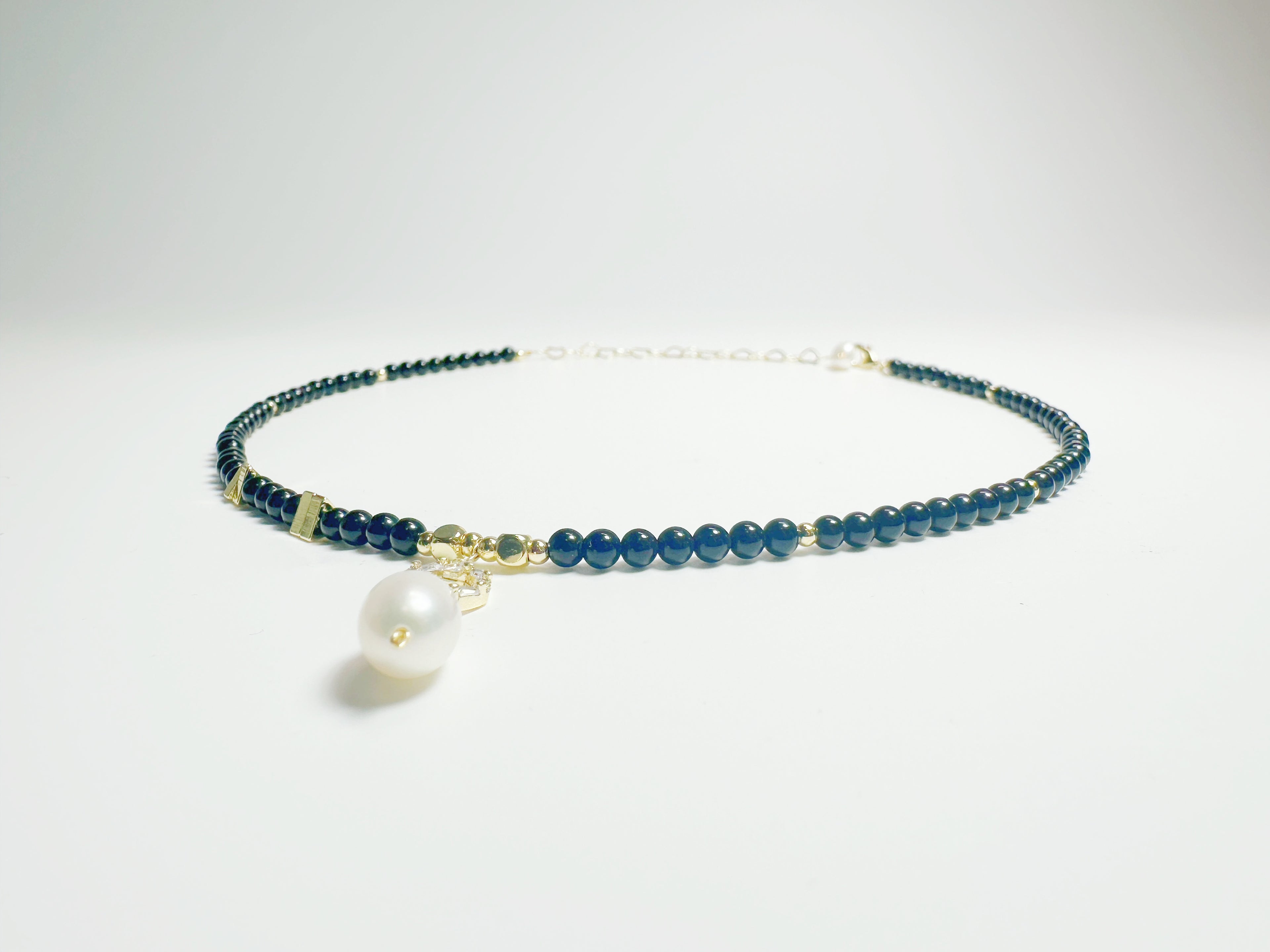 The Jìng(静):  Feng Shui Black Agate & Pearl bracelet for protection + intuition boost. Hand-polished metaphysical talisman with optional Baiyun Temple blessing. Shields against negative energy .