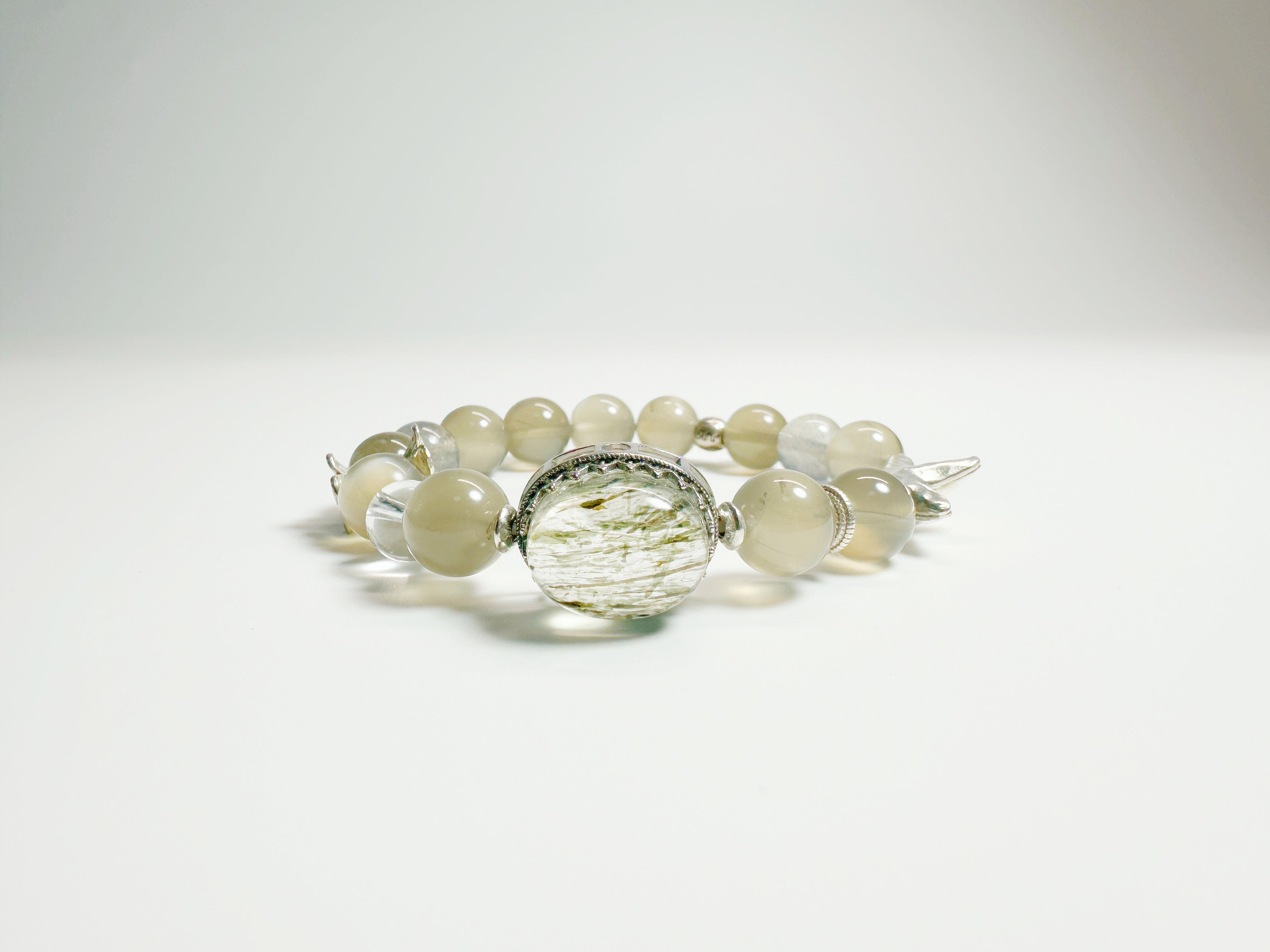 Feng Shui Stone & moonstone garden pendant with tourmaline quartz. Combines silver moonstone clarity + green tourmaline protection. Optional Baiyun Temple blessing for cosmic energy alignment.