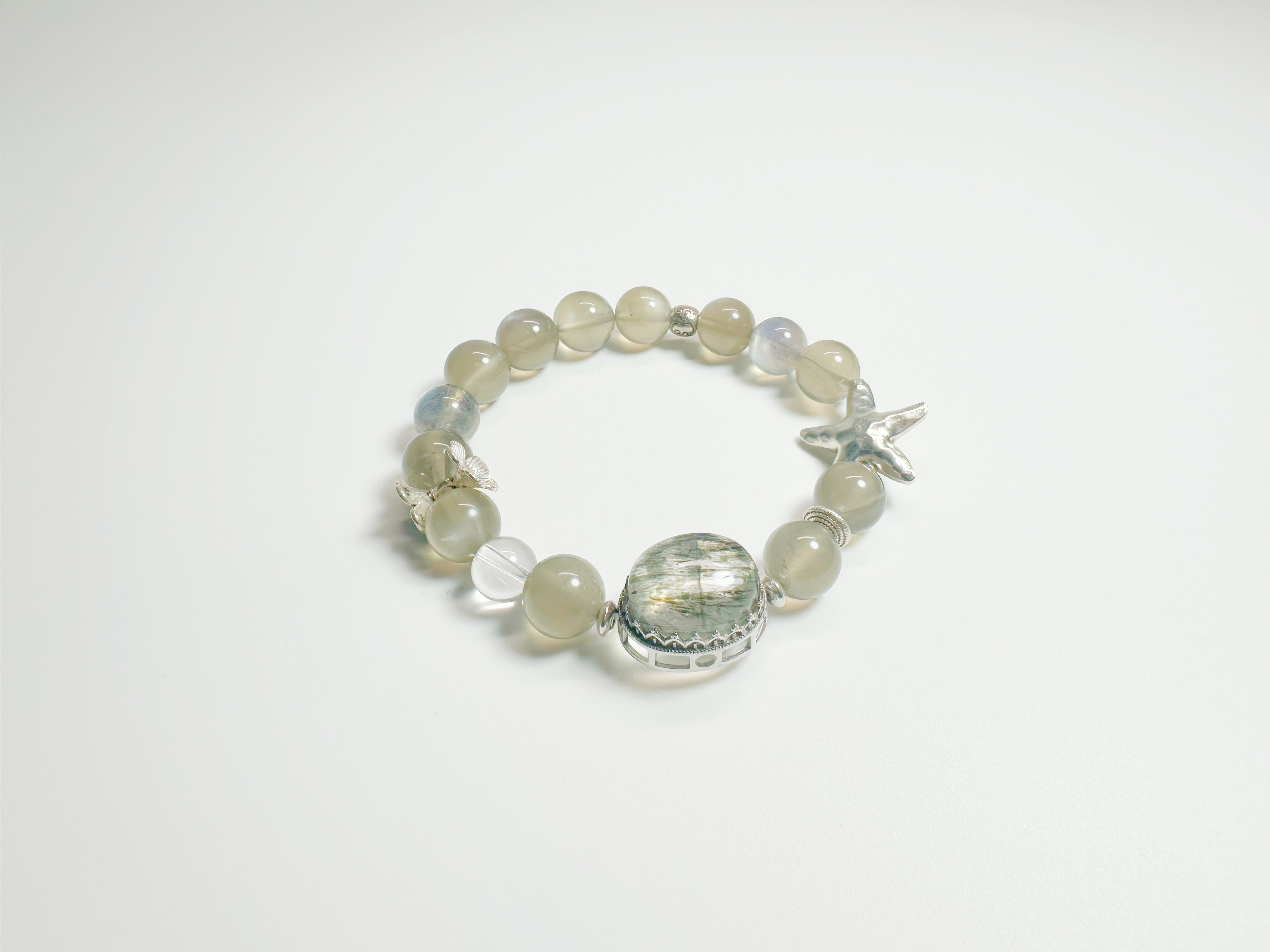 Feng Shui Stone & moonstone garden pendant with tourmaline quartz. Combines silver moonstone clarity + green tourmaline protection. Optional Baiyun Temple blessing for cosmic energy alignment.